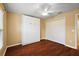 Bedroom with hardwood floors, a closet and a murphy bed at 5071 Harbour Dr, Oxford, FL 34484