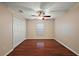 Bedroom showcasing hardwood floors, closet, and a window at 5071 Harbour Dr, Oxford, FL 34484