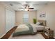 Bedroom featuring a ceiling fan, and a double door closet, providing ample storage and comfort at 5071 Harbour Dr, Oxford, FL 34484
