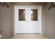 Elegant double front doors with decorative glass panels and stylish hardware at 5071 Harbour Dr, Oxford, FL 34484
