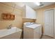 Laundry room featuring a sink, washer and dryer at 5071 Harbour Dr, Oxford, FL 34484