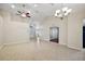 Spacious living room with tile floors, vaulted ceilings, fan, and chandelier at 5071 Harbour Dr, Oxford, FL 34484