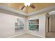 Bright room with multiple windows, neutral paint, and tile floors, perfect for an office at 5071 Harbour Dr, Oxford, FL 34484