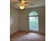 Bright bedroom featuring a window with sheer curtains and ample light at 5268 Sw 110Th Pl, Ocala, FL 34476