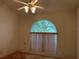Arched window with lots of natural light and ceiling fan at 5268 Sw 110Th Pl, Ocala, FL 34476