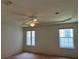 Bedroom with neutral walls, two windows with blinds, and a ceiling fan at 5268 Sw 110Th Pl, Ocala, FL 34476