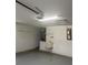 The garage features a utility sink, and overhead door hardware, along with an exposed ceiling at 5268 Sw 110Th Pl, Ocala, FL 34476