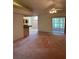 Spacious area with a view of the kitchen and sliding doors at 5268 Sw 110Th Pl, Ocala, FL 34476