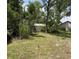 Backyard featuring a small shed at 5268 Sw 110Th Pl, Ocala, FL 34476