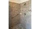 Tiled shower with handrail and mosaic tile floor at 5268 Sw 110Th Pl, Ocala, FL 34476