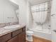 Bathroom features a shower/tub combo with curtain, tile flooring, and a vanity with mirror at 5719 Spartina Ter, The Villages, FL 32163