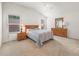 Inviting bedroom with a neutral color palette, ceiling fan, and natural light at 5719 Spartina Ter, The Villages, FL 32163