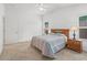 Spacious bedroom has great natural light, neutral tones, and a ceiling fan at 5719 Spartina Ter, The Villages, FL 32163