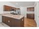 Bright kitchen offers stainless steel appliances, stylish cabinets, and laminate countertops at 5719 Spartina Ter, The Villages, FL 32163