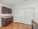 Bright kitchen with matching cabinets and a laminate countertop plus a walk-in pantry at 5719 Spartina Ter, The Villages, FL 32163