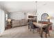 Inviting living area with a dining table, comfortable seating, and an open flow to the kitchen at 5719 Spartina Ter, The Villages, FL 32163