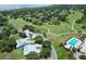 An aerial shot showing a home located near the golf course, lake, and the neighborhood pool at 6036 Topsail Rd, Lady Lake, FL 32159