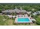 An elevated view of the clubhouse and pool area, showcasing a serene spot for relaxation and recreation at 6036 Topsail Rd, Lady Lake, FL 32159