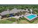 Aerial image of a well-appointed clubhouse with a pool, offering a luxurious experience at 6036 Topsail Rd, Lady Lake, FL 32159