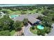 Aerial view of the clubhouse, pool, and golf course at 6036 Topsail Rd, Lady Lake, FL 32159