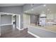 Modern kitchen with white cabinets, stainless appliances, and a breakfast bar at 6036 Topsail Rd, Lady Lake, FL 32159