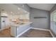 Charming kitchen with white cabinets, granite countertops, and an open layout at 6036 Topsail Rd, Lady Lake, FL 32159