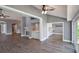 Inviting living room with wood floors, a fireplace, and an open layout at 6036 Topsail Rd, Lady Lake, FL 32159