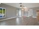 Spacious living room featuring wood floors, crown moulding, and a ceiling fan at 6036 Topsail Rd, Lady Lake, FL 32159