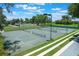 Well-maintained pickleball courts with new striping, landscaping and lighting at 6036 Topsail Rd, Lady Lake, FL 32159