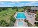 Aerial view of community pool, hot tub and golf course at 6036 Topsail Rd, Lady Lake, FL 32159