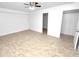 Bright bedroom features ceiling fan, closet, and neutral tones at 624 Australian Way, Davenport, FL 33897