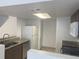 Functional kitchen featuring granite countertops and stainless steel appliances for modern living at 624 Australian Way, Davenport, FL 33897