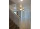 Entry staircase leading to a large living area with tiled floors and fan at 624 Australian Way, Davenport, FL 33897