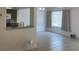 Spacious living area with tiled floors, adjacent to a kitchen with granite countertops at 624 Australian Way, Davenport, FL 33897