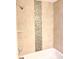 Shower-tub with modern tile surround and sleek shower head at 624 Australian Way, Davenport, FL 33897