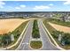 Aerial view of the Trinity Lakes entrance, showcasing the landscaped median and well-planned community at 6946 Perch Hammock Loop, Groveland, FL 34736