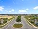 Scenic view of the Trinity Lakes community entrance with lush landscaping and a welcoming sign at 6946 Perch Hammock Loop, Groveland, FL 34736