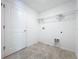 Laundry room with tile floors and washer/dryer hookups at 6946 Perch Hammock Loop, Groveland, FL 34736