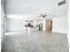 Open-concept living space featuring tile floors, kitchen and natural light at 6946 Perch Hammock Loop, Groveland, FL 34736