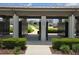 A sheltered cluster mailbox structure surrounded by landscaping at 6946 Perch Hammock Loop, Groveland, FL 34736