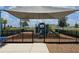 Community playground featuring play structures, swings, and seating, all shaded for comfort at 6946 Perch Hammock Loop, Groveland, FL 34736