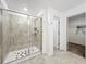 Shower features decorative tile and built-in shelves at 6946 Perch Hammock Loop, Groveland, FL 34736