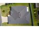 Aerial view shows new roof, rear patio and landscaping at 6949 Minchew Cir, The Villages, FL 34762