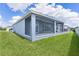Spacious screened lanai with multiple windows and sliding glass doors offering seamless indoor/outdoor living at 6949 Minchew Cir, The Villages, FL 34762