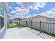 Spacious patio area with black metal railing perfect for outdoor relaxation and entertaining at 6949 Minchew Cir, The Villages, FL 34762