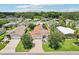 Features a well-maintained property with lush greenery and a neighborhood at 703 Royal Palm Ave, Lady Lake, FL 32159