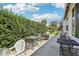 Extended back patio area with ample seating, perfect for entertaining and relaxing at 703 Royal Palm Ave, Lady Lake, FL 32159