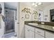 Bathroom featuring walk-in shower, modern fixtures, and a tastefully decorated space at 703 Royal Palm Ave, Lady Lake, FL 32159