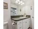 Bathroom featuring a sink with a large mirror and storage at 703 Royal Palm Ave, Lady Lake, FL 32159