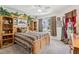 Spacious bedroom featuring a unique jungle themed decor and abundant natural light at 703 Royal Palm Ave, Lady Lake, FL 32159